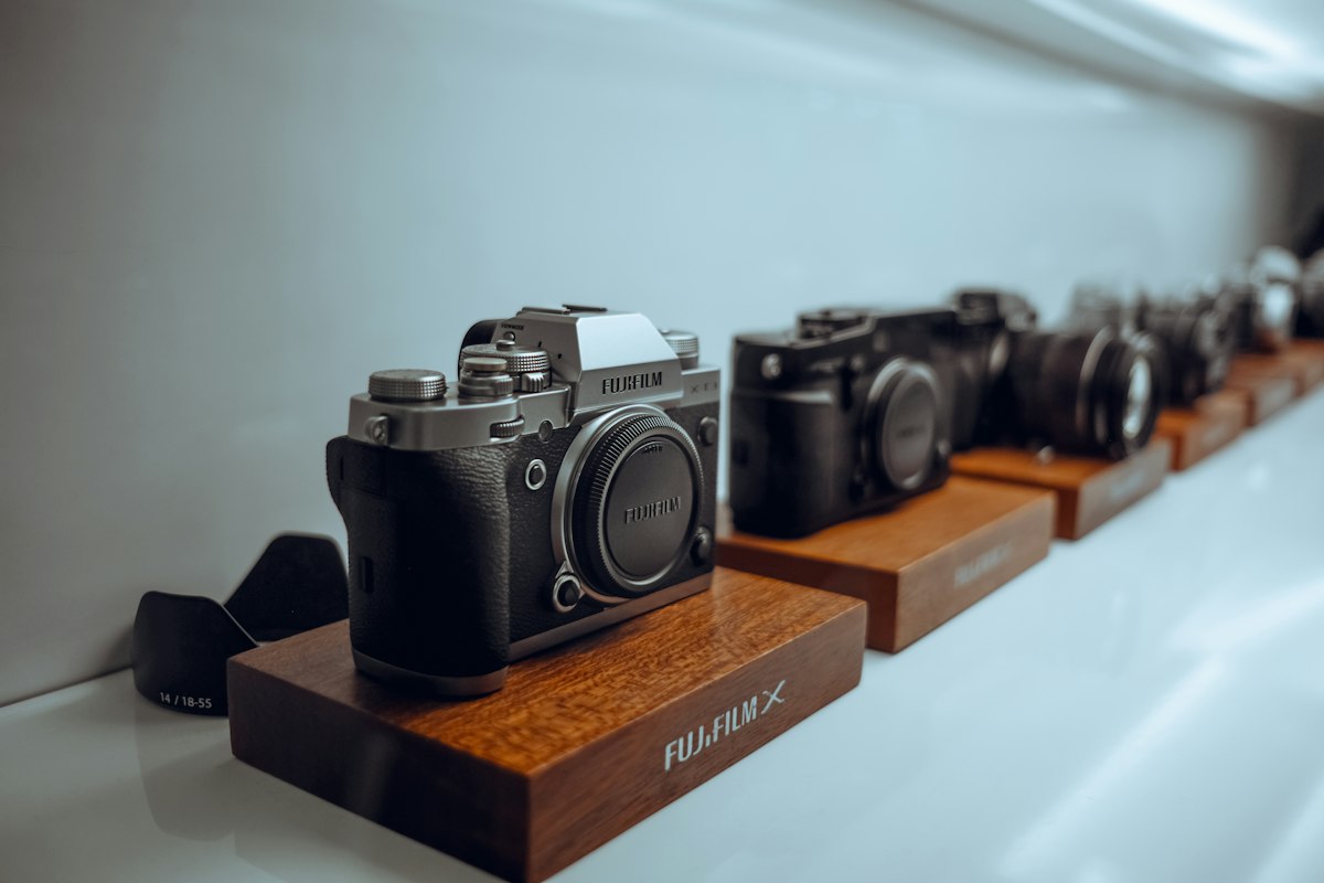 A mirrorless camera resting on a wooden table