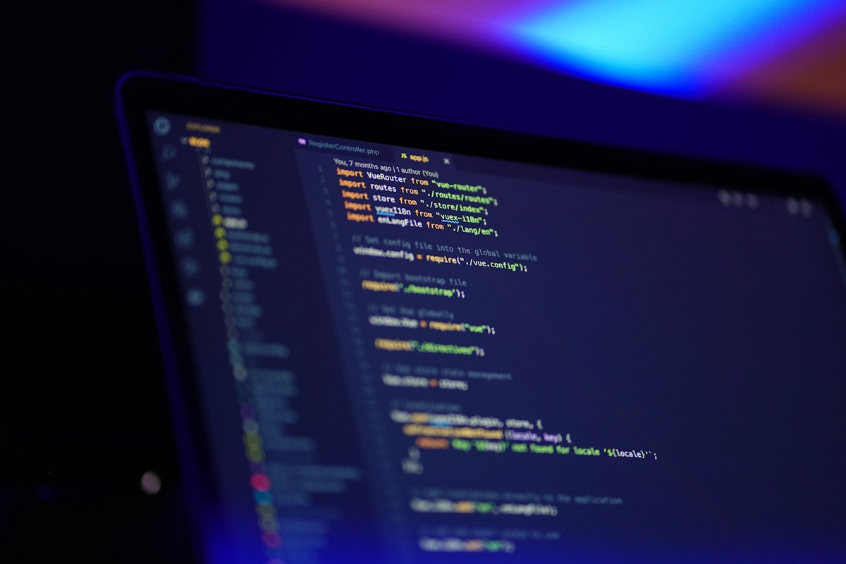 Colorful source code displayed on a laptop screen